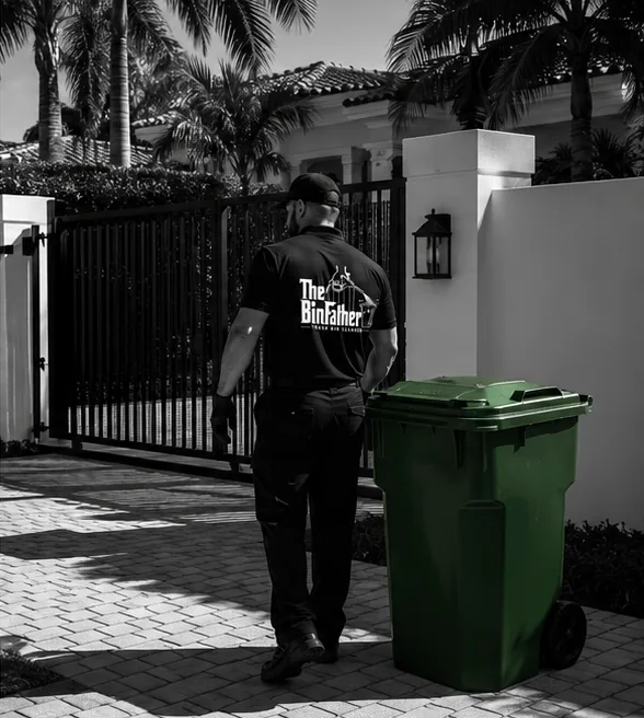 A technician returning a clean cart to a gated South Florida driveway